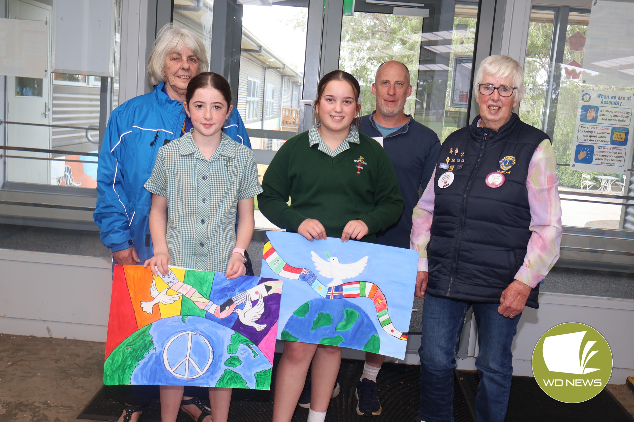 Peace: Members of the Mortlake Lions last week visited Mortlake College to announce the winner of this year’s International Peace Poster Contest.