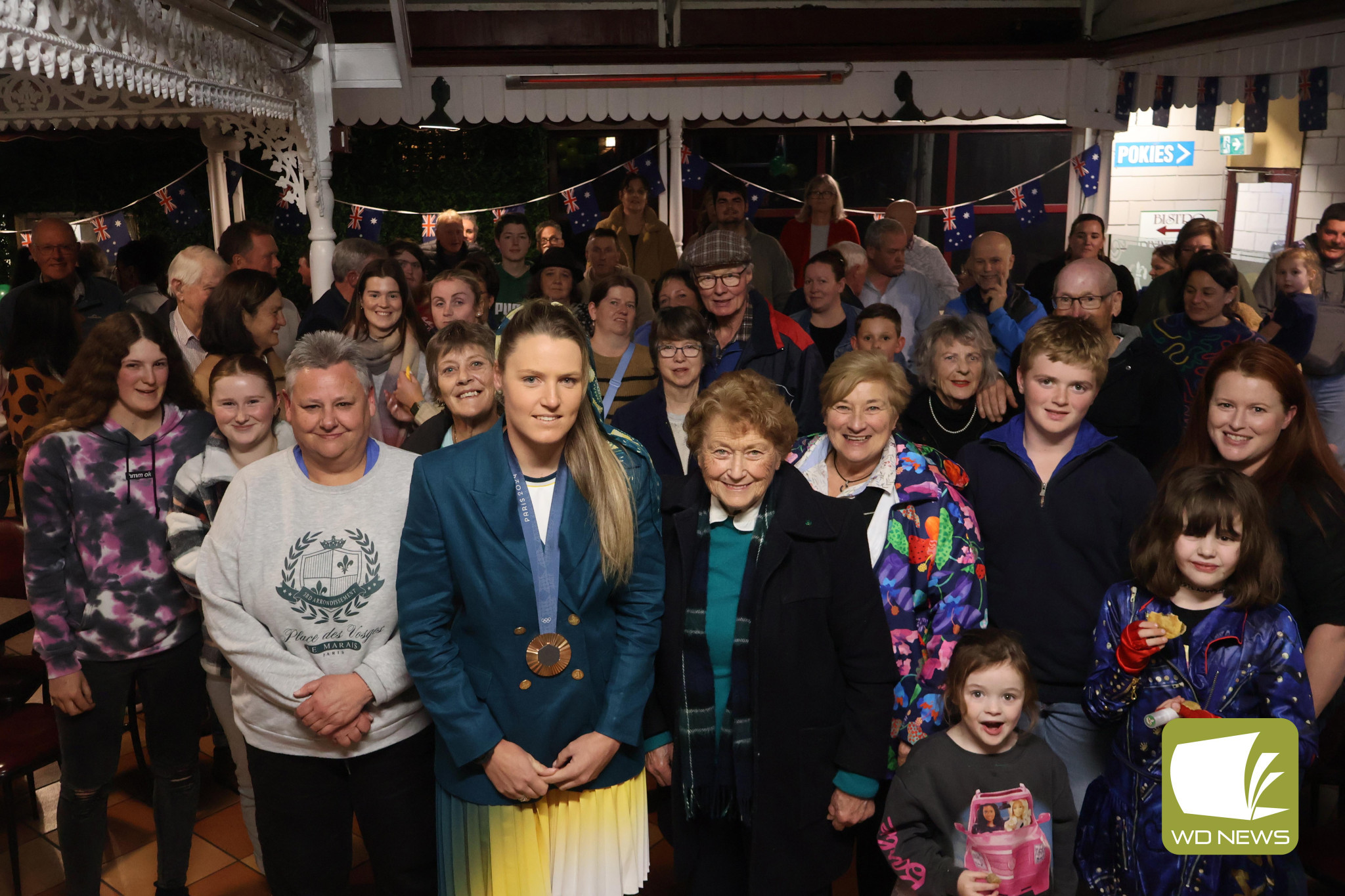 Welcome home: A large crowd filled the Commercial’s courtyard to welcome Olympian Penny Smith home.