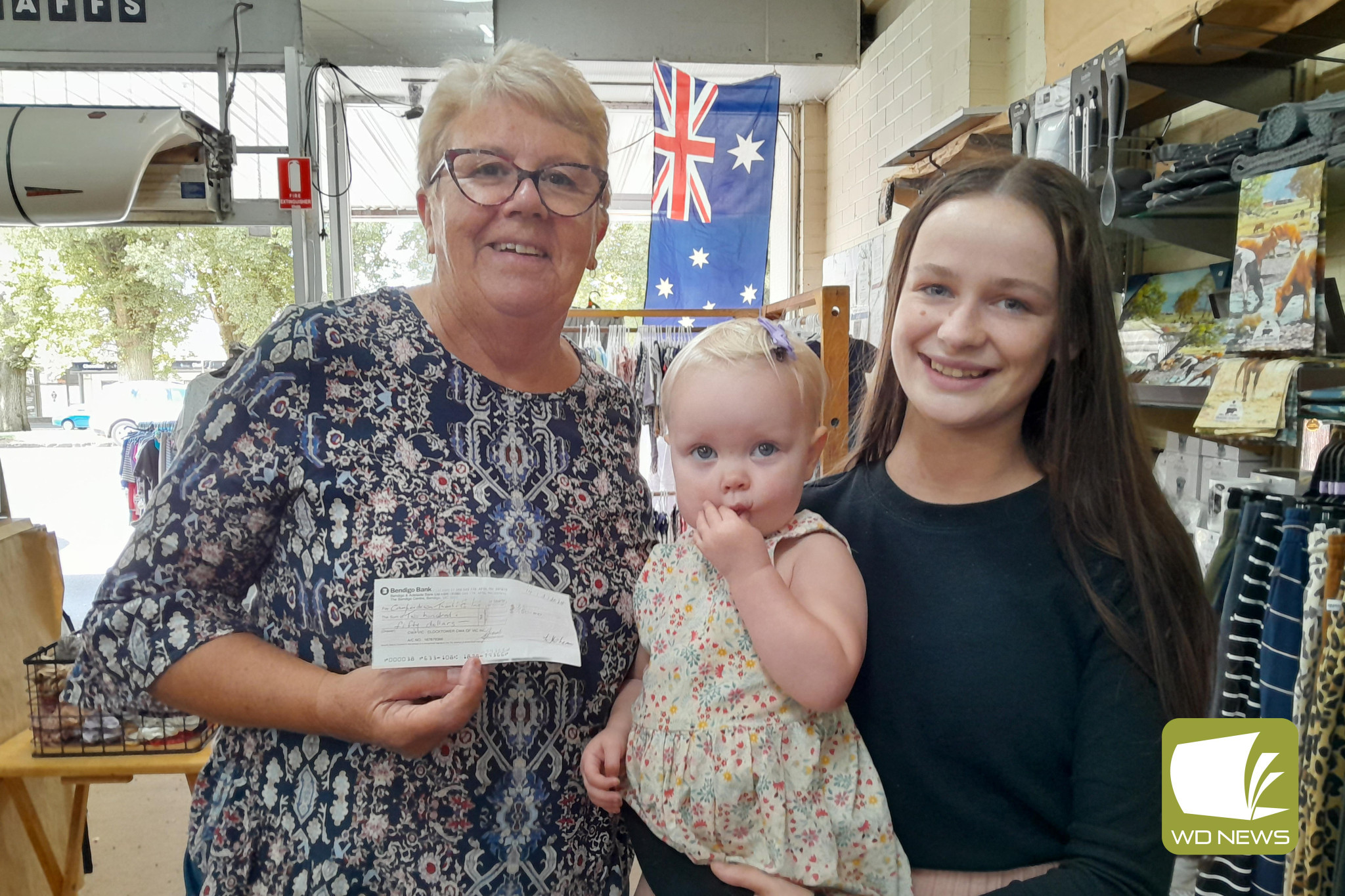 A surprise donation: Camperdown CWA member Julie Tune, pictured with Camperdown Theatre Company actress Madidi McKenzie, dropped into Laffs last Thursday to donate funds to replace the piano seat at the Theatre Royal.