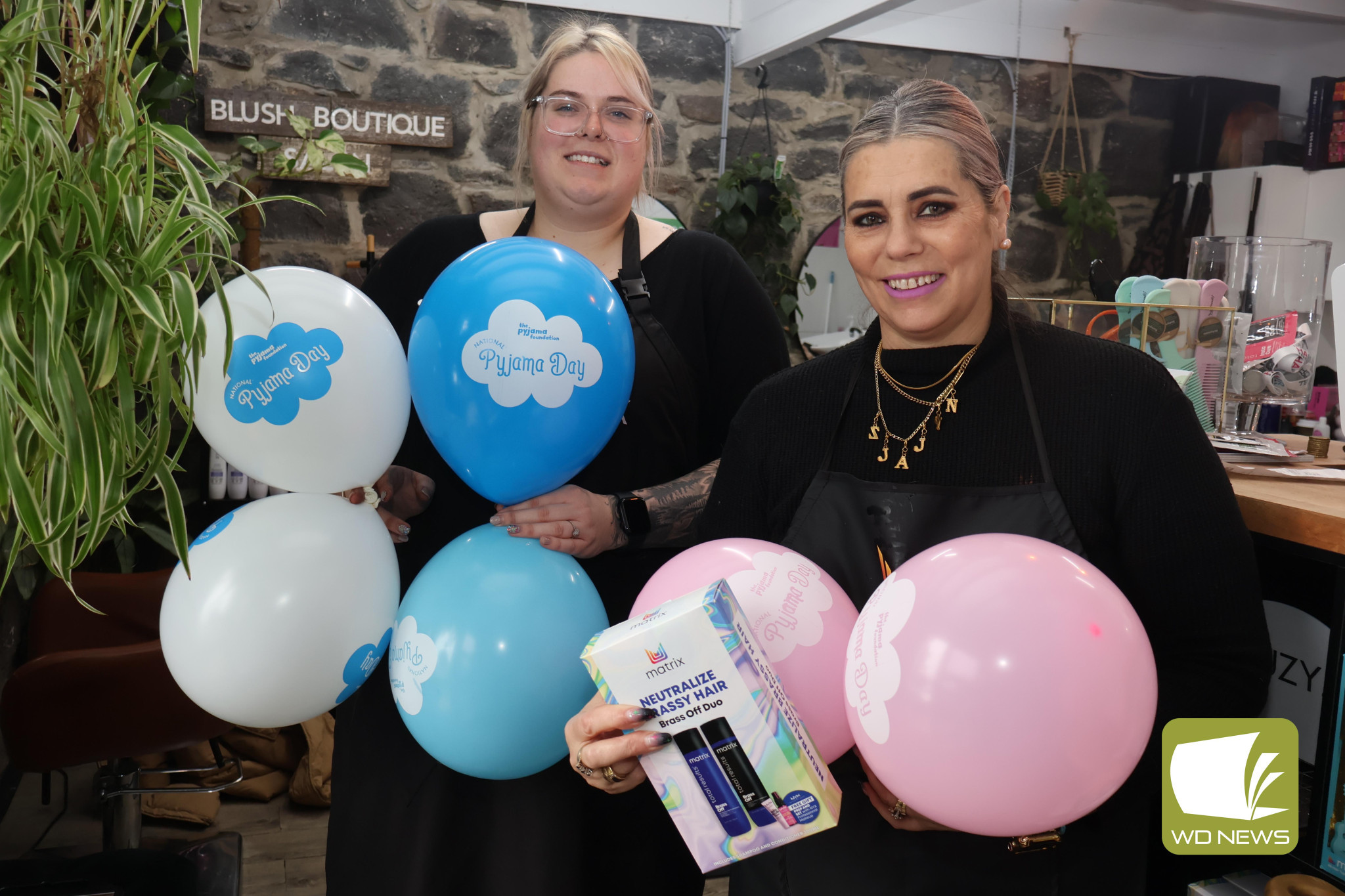 Nobody left behind: Blush Boutique Salon manager Emily Thorne and senior hairdresser Naomi Gibbs wore their pyjamas to work last week as part of a national fundraiser to support children in foster care.