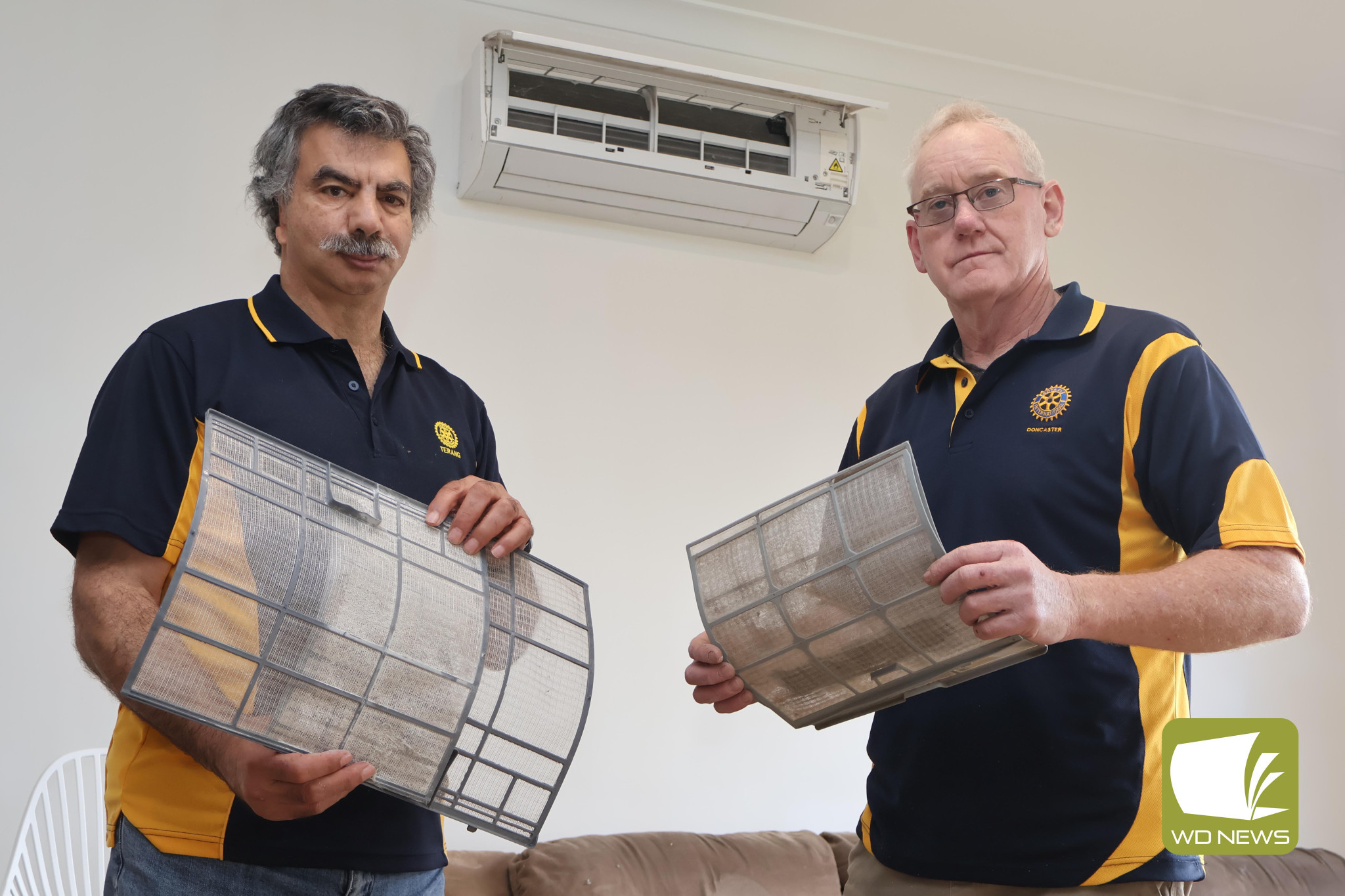 Giving back: Terang and District Rotary Club members Wayne Reicha and Paul Blain will launch a free service helping disadvantaged members of the community with cleaning their split system air conditioning units.