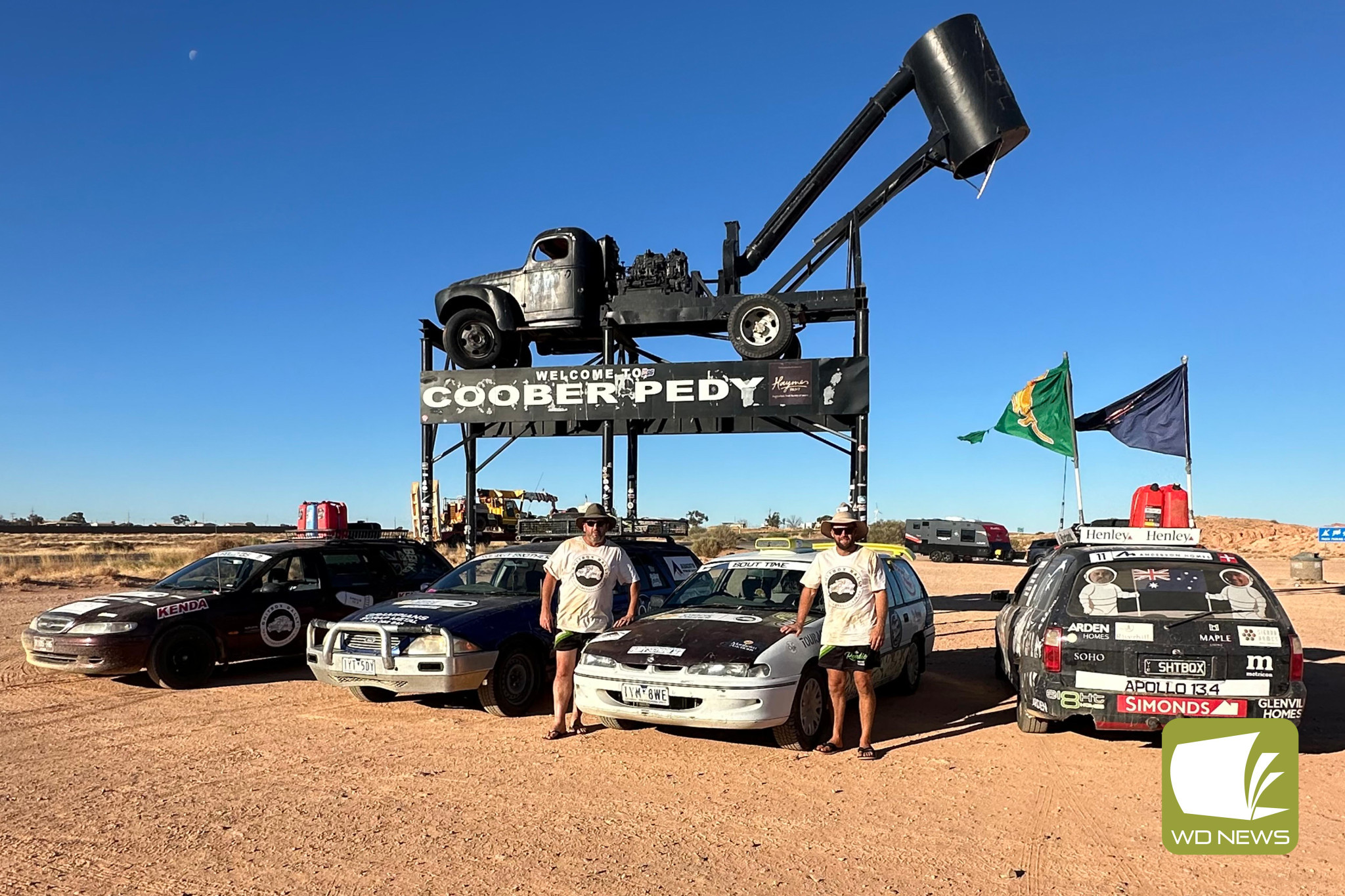 Off the beaten track: Dwayne Dolling and Jason McGlynn are currently traversing the rugged Australian outback in a dodgy old Holden Commodore, having raised more than $11,000 for cancer research as part of their journey.