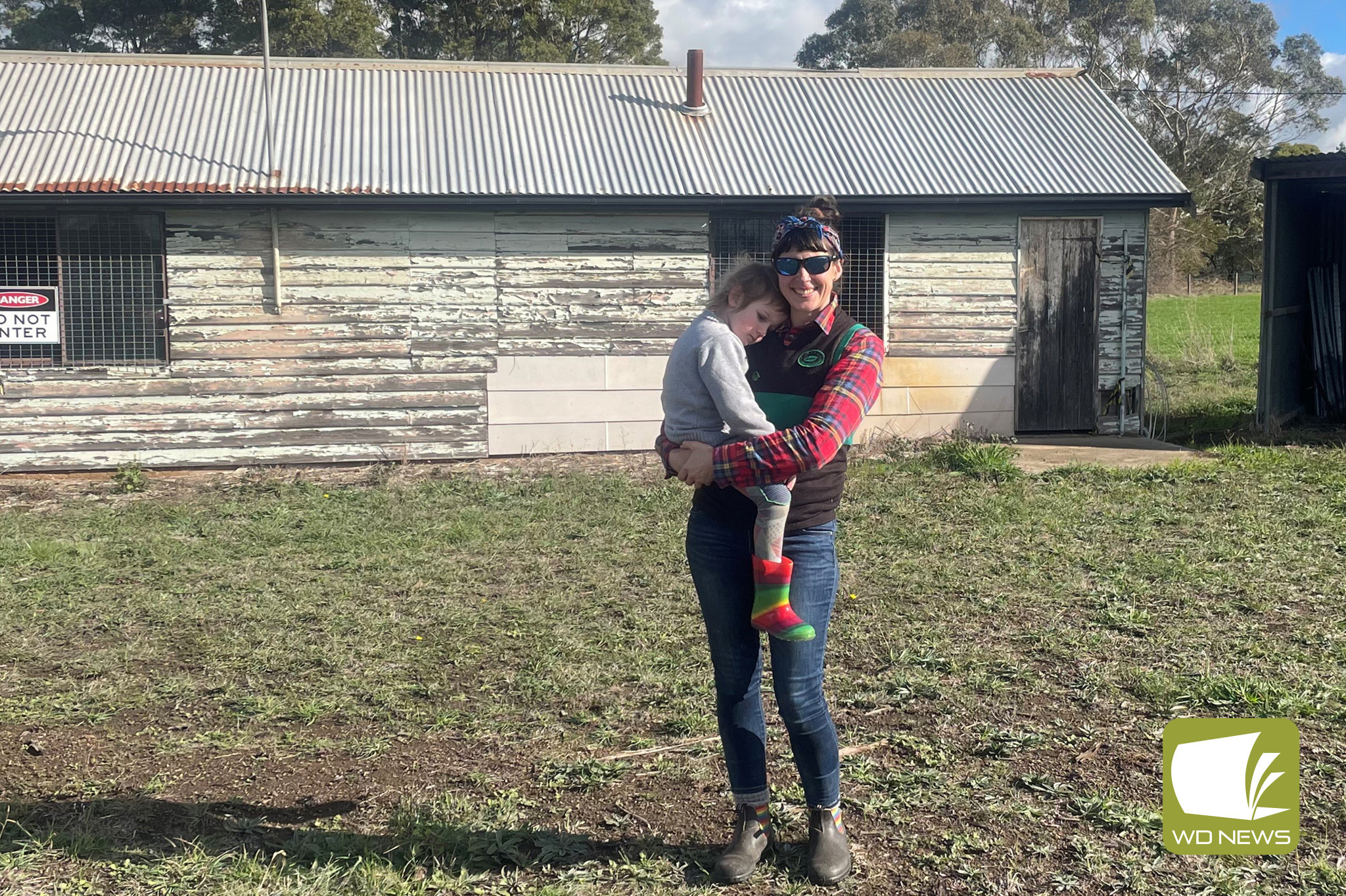 South Purrumbete Recreation Reserve president Becky McCann with daughter Ari in front of the old home team changerooms at South Purrumbete.