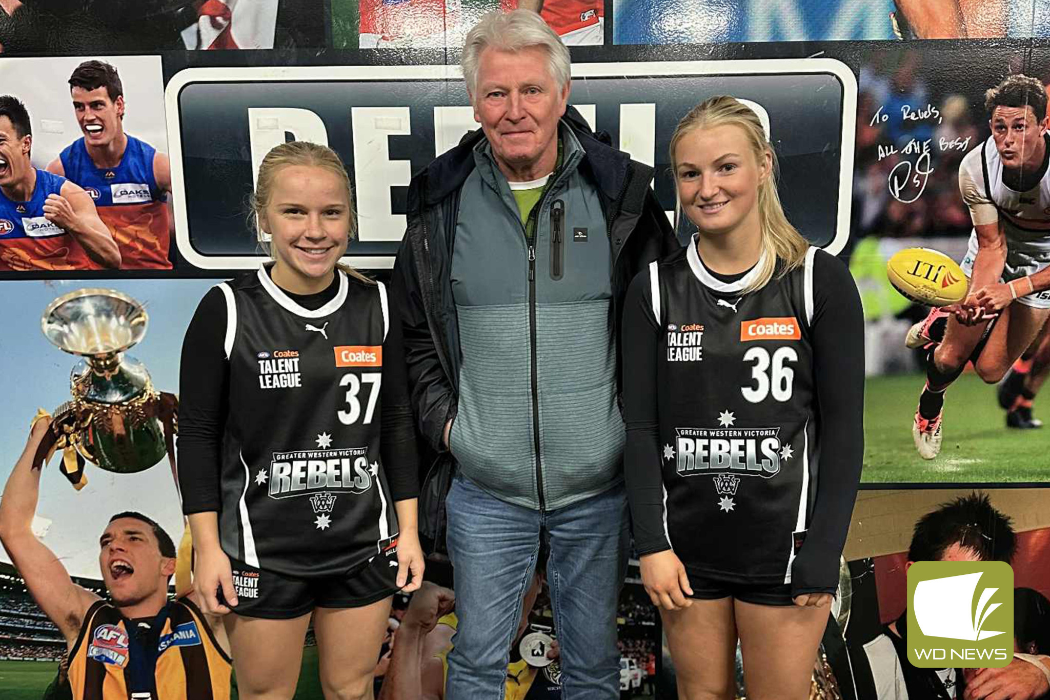 Bloods footballers Tayla Bell and Indi Cameron with Terang Mortlake’s under 18 women’s team manager, Noel McConnell.