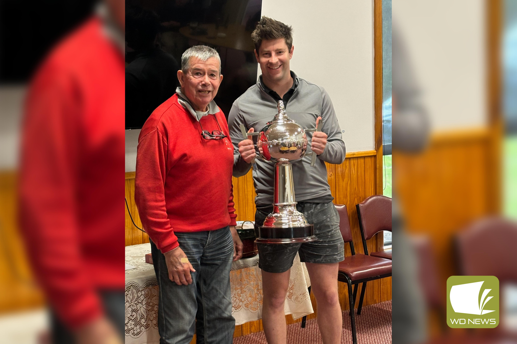 Barry Cook presents Jamie Norton with the Bill Neal Memorial trophy