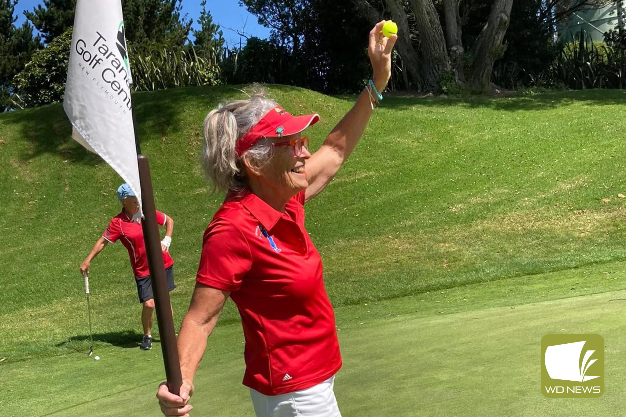 Nelle Cashmore celebrates a hole-in-one in NZ.