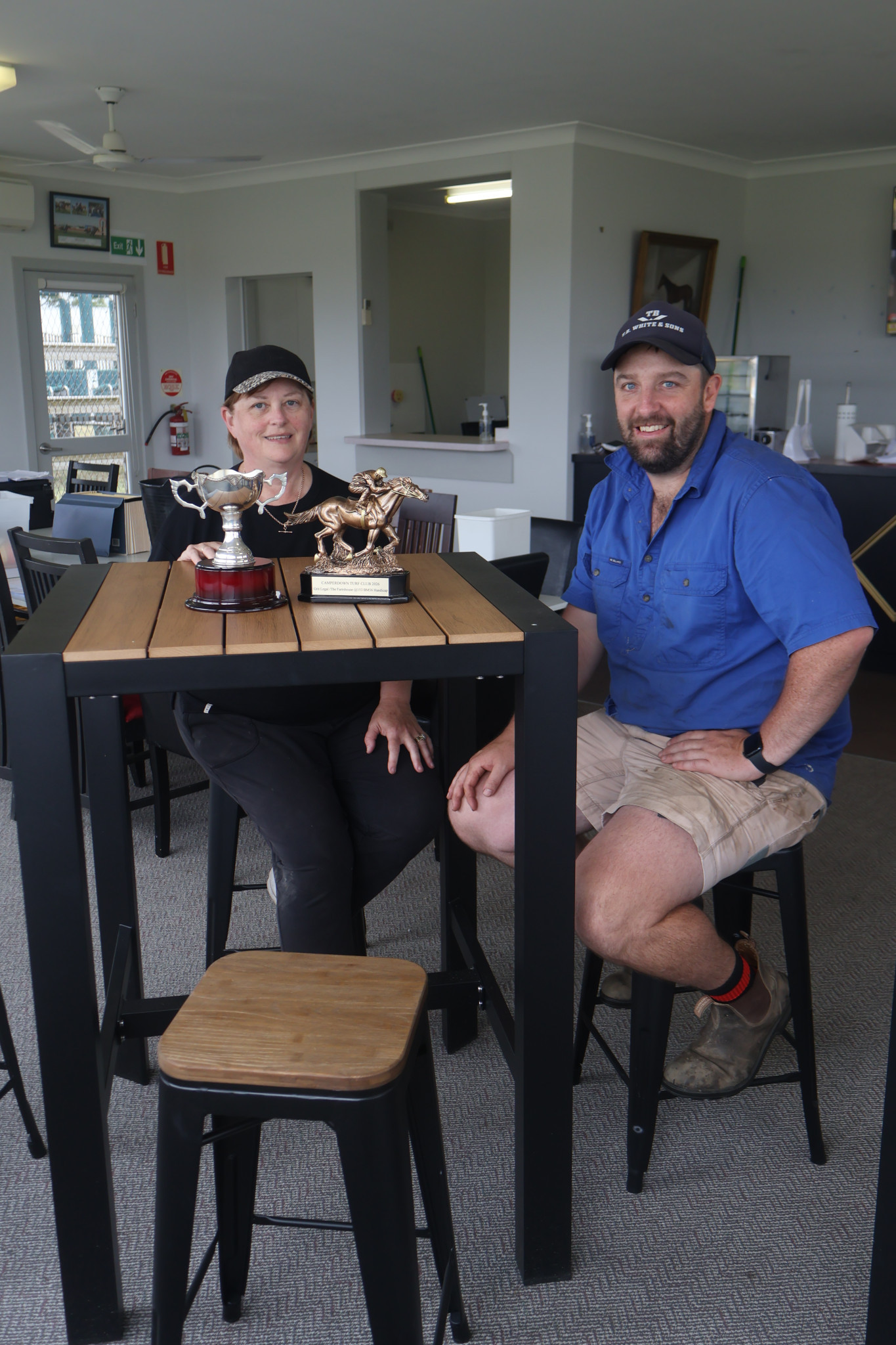 FRESH FURNITURE: Camperdown Turf Club president Rose Henry and vice president Eddie Lucas with new tables and stools funded by the State Government.