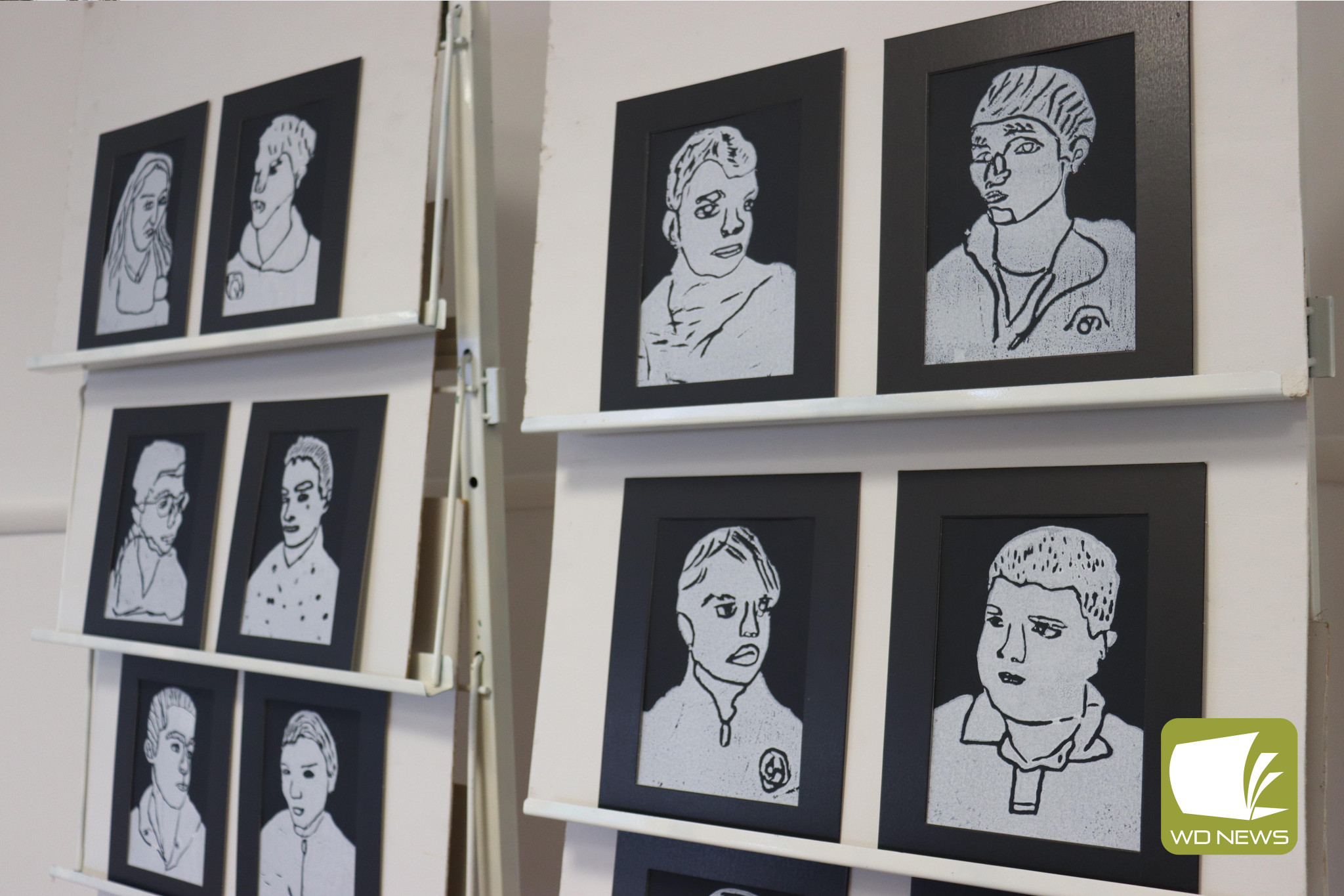 On display: Completed self-portraits of the Hampden P-12 Middle Years students are available for viewing alongside various interpretations of places across Corangamite Shire at the Cobden Visitor Information Centre.