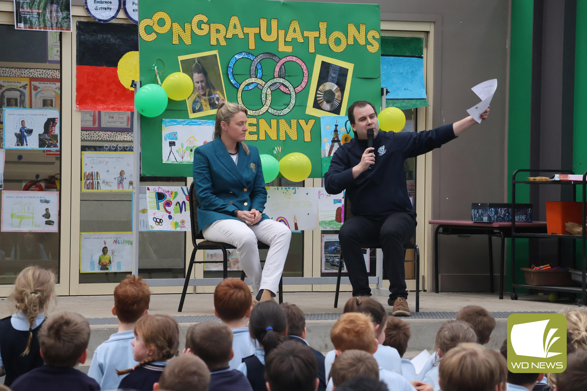 Green and gold: Olympic bronze medallist Penny Smith, pictured with St Thomas’ Primary School principal Matthew Uzkuraitis, took time to answer questions about her experience representing Australia at the 2024 Paris Olympics.