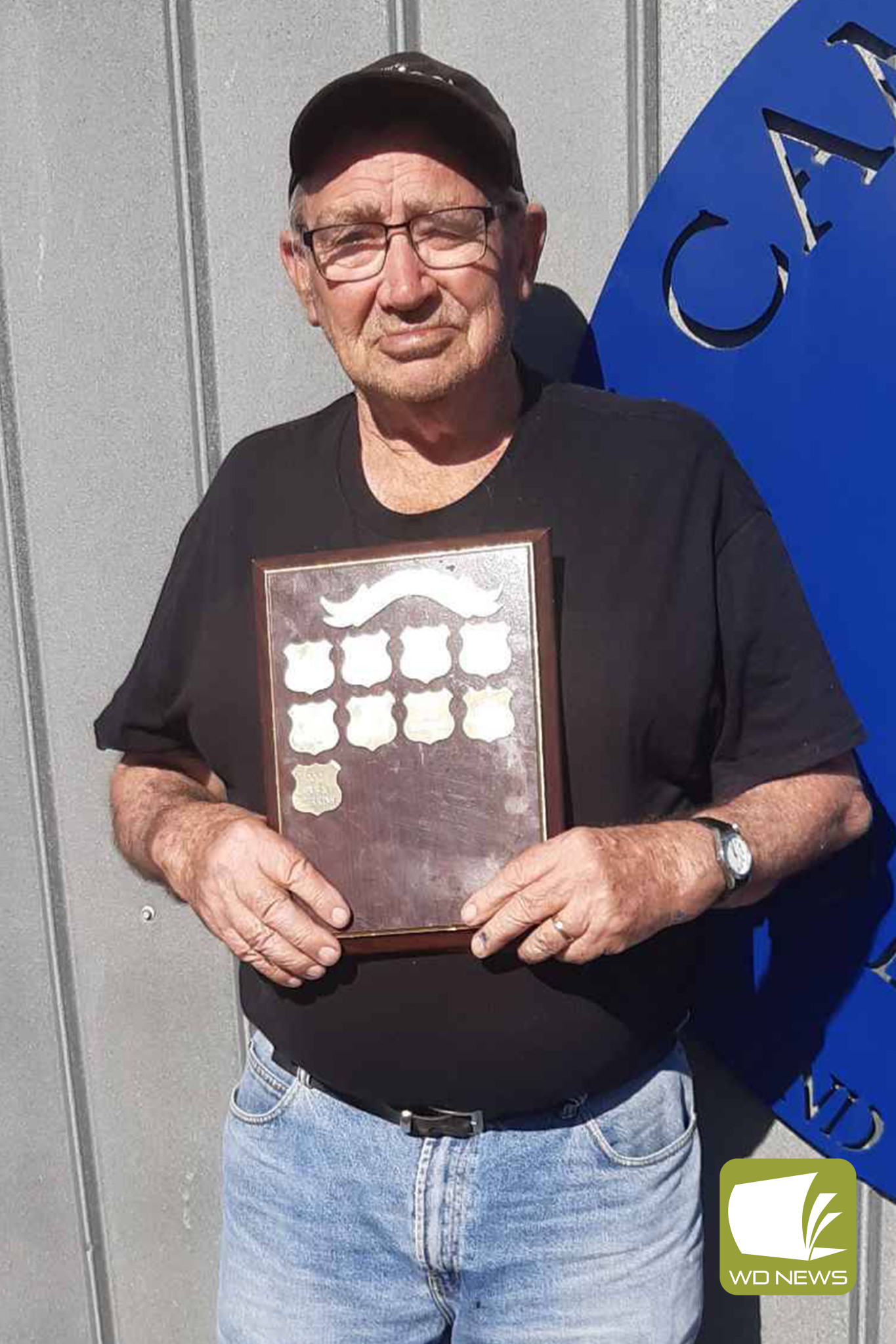 Rex Perkins with the J. Ellis Memorial Shield.