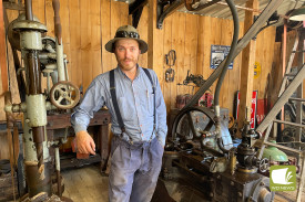 Nathan Woodruff shows off a steam engine at the annual South Western District Restoration Group annual rally over the weekend.