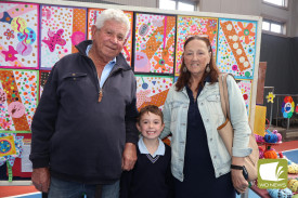 Kim Taylor, Leo Taylor and Yvonne Taylor looked at the student artwork on display.