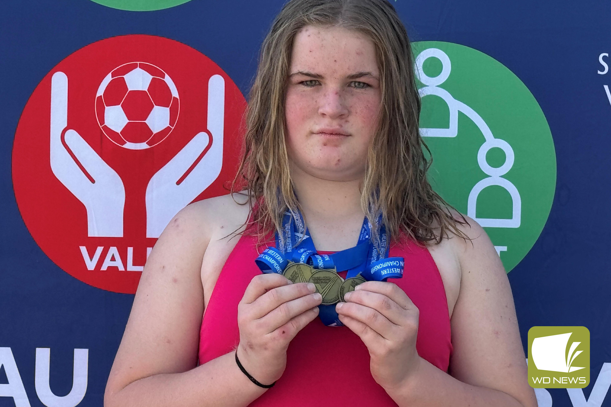 Summer Sharp with her medal haul.